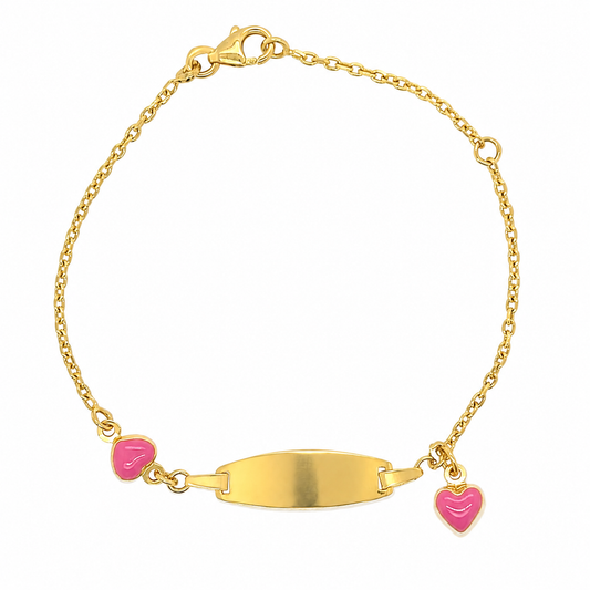A gold chain ID bracelet with a central oval plate and two small pink heart charms, shown on a plain white background.