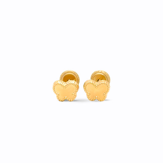Gold butterfly earrings on a white background