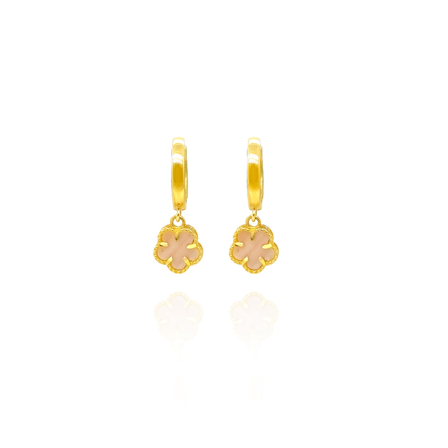 Gold hoop earrings with pink flower charms on a white background