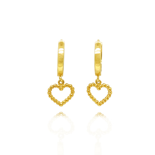14K gold huggie earrings with polished hoops and dangling beaded heart charms.