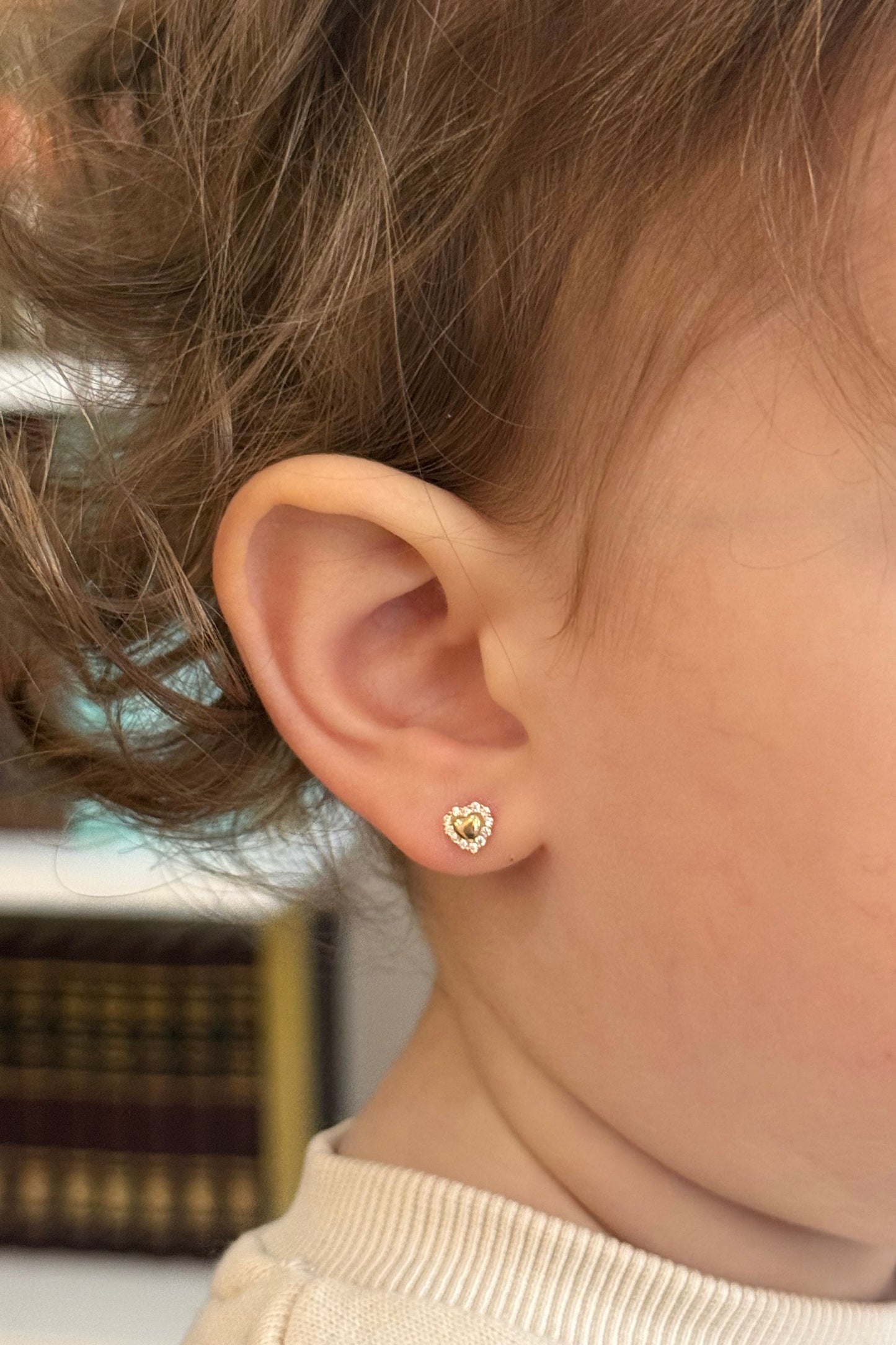 Little girl wearing 14K gold CZ heart screw back earrings safe kids fine jewelry