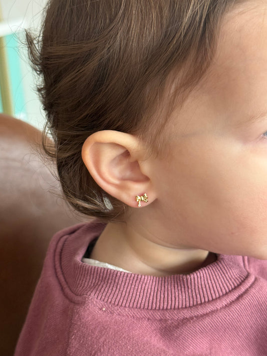 Little girl wearing 14K gold ribbon screw back earrings safe kids fine jewelry