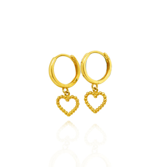 Side view of 14K gold beaded heart drop huggie earrings with polished gold hoops.