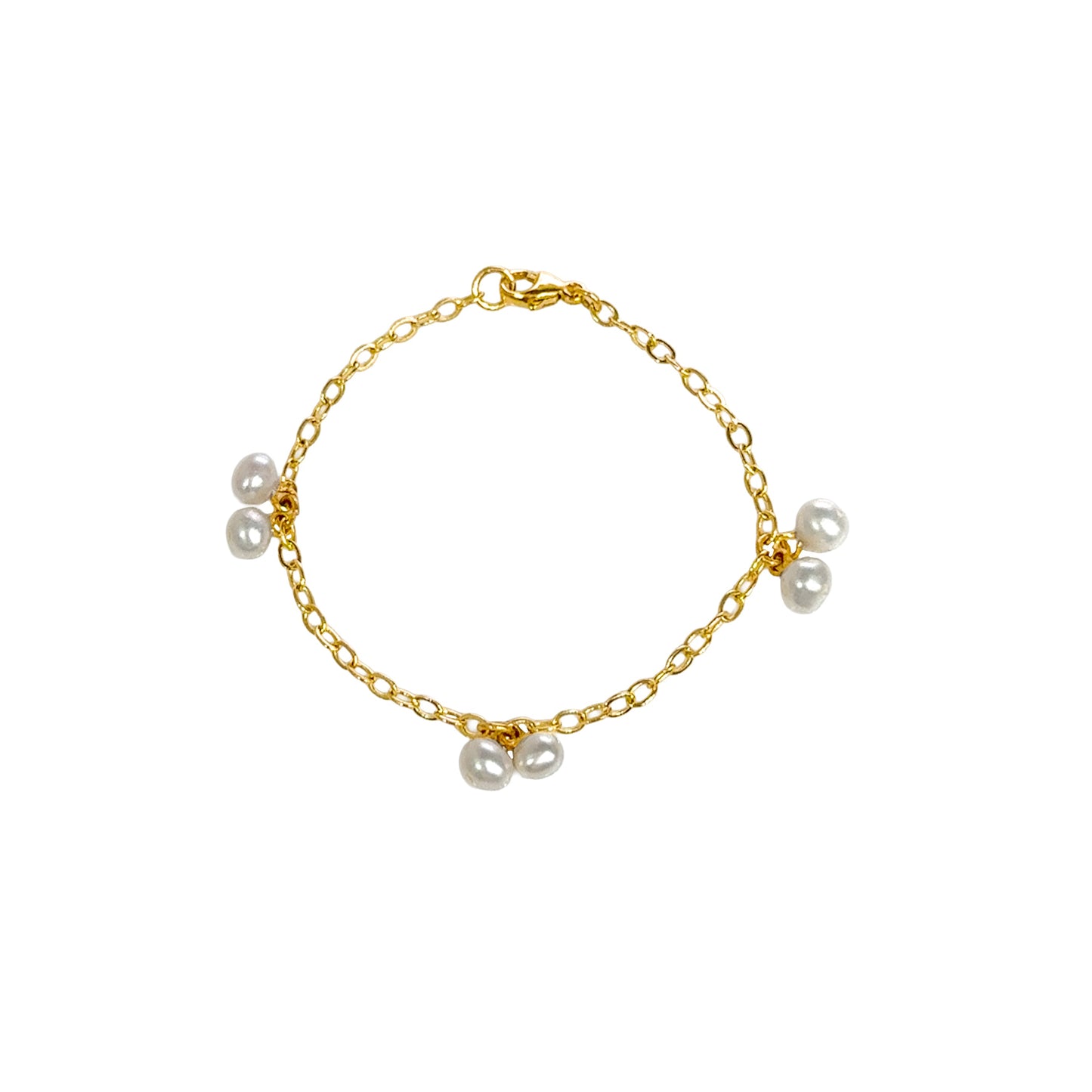 Gold bracelet with pearls on a white background