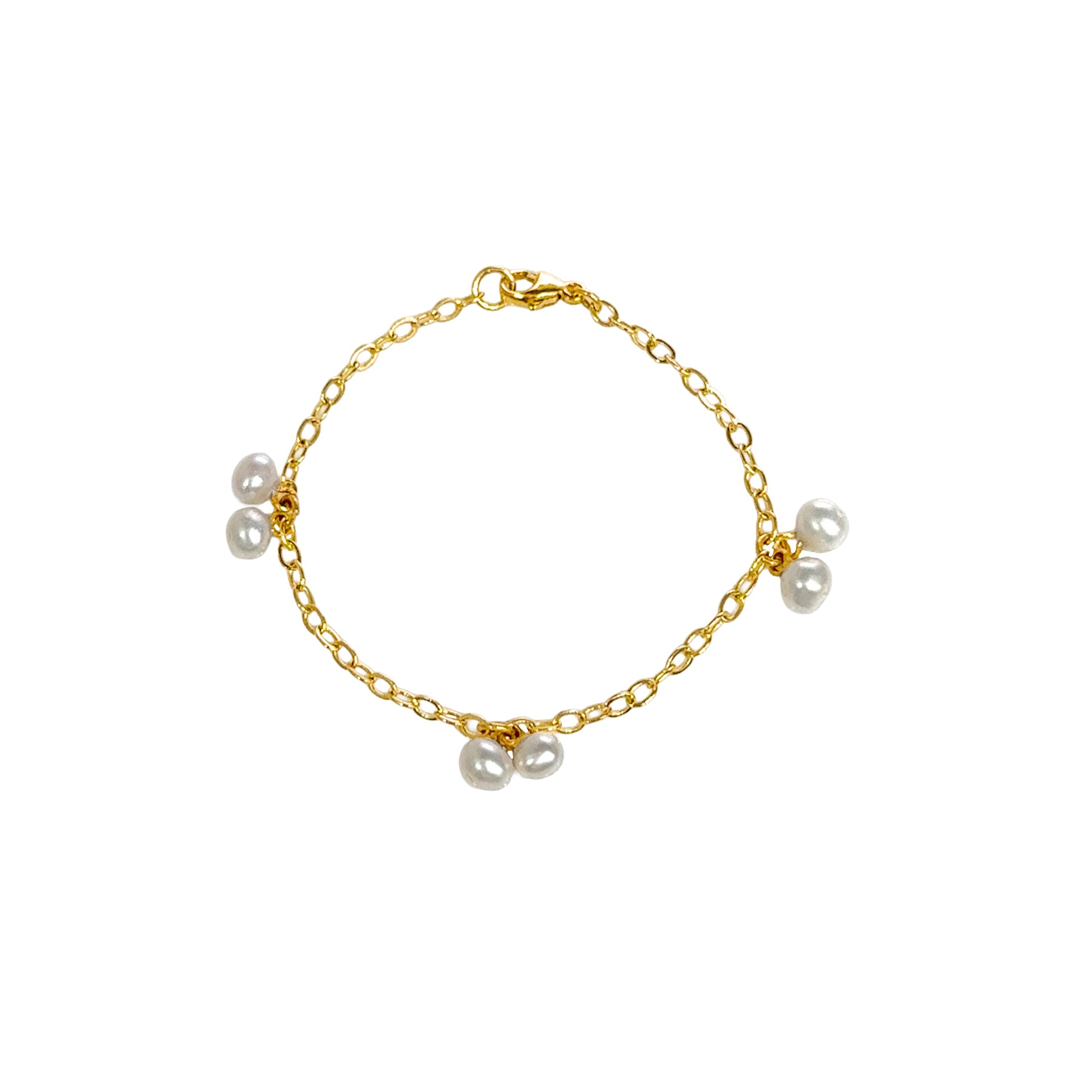 Gold bracelet with pearls on a white background
