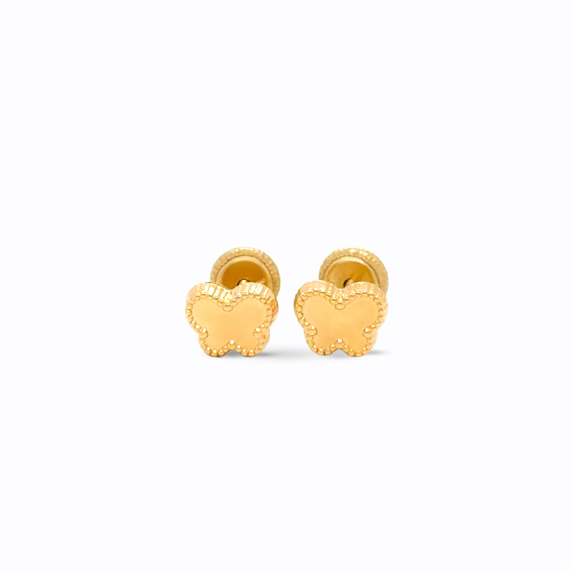 Gold butterfly earrings on a white background
